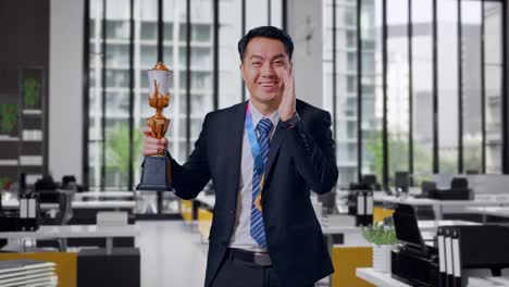 businessman celebrating victory in office