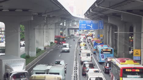 busy city street with congestion under overpass