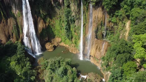 a stunning drone shot of the tropical thi lo su waterfall located off the beaten track in the backpackers paradise of north thailand in the area of umphang in southeast asia