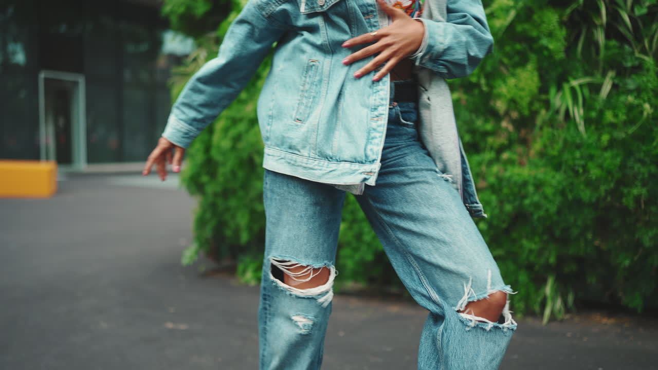 Woman in denim jacket and crop top
