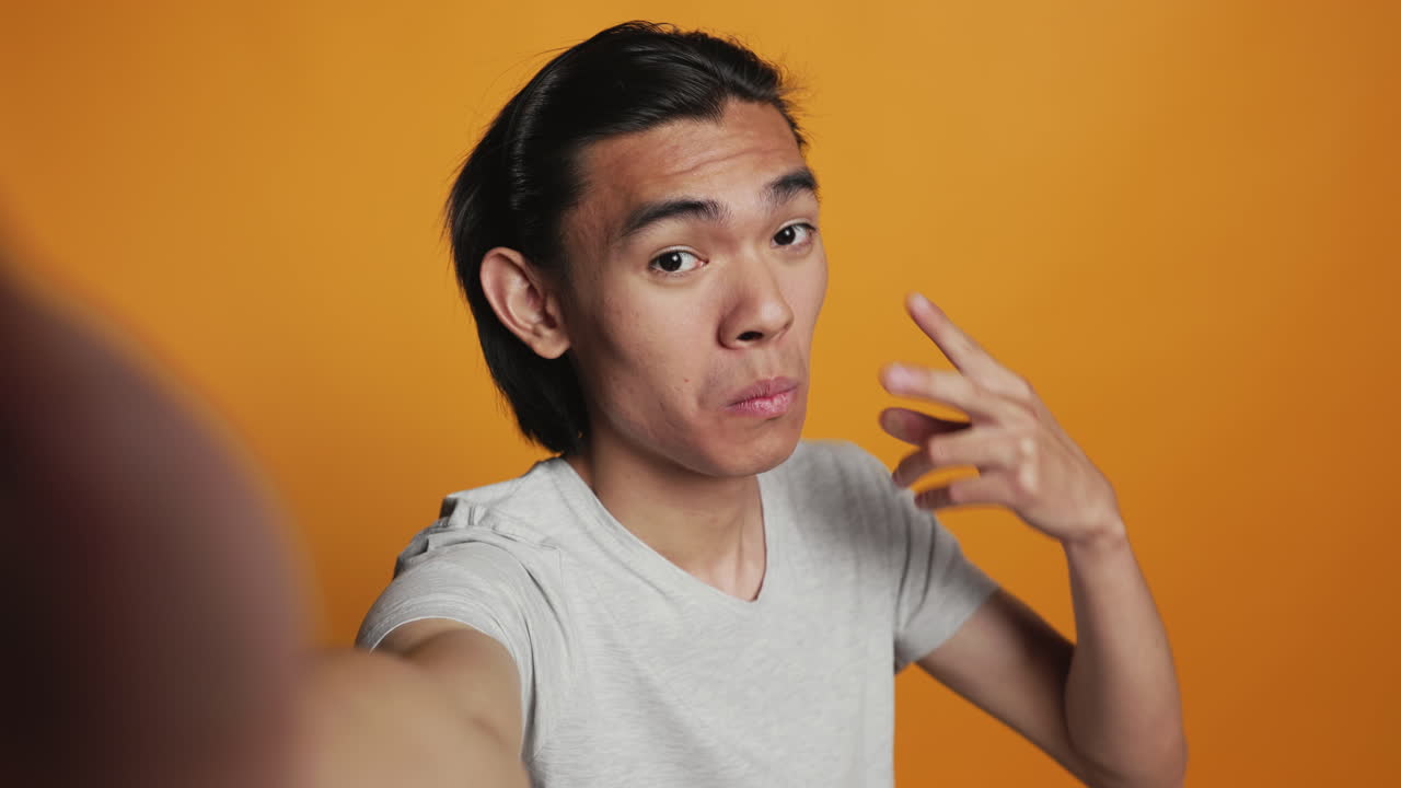 POV of positive adult taking photos on camera