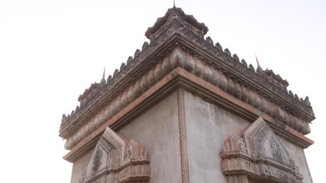 looking up at the detailed intricate patuxai victory monument in the center of vientiane, laos