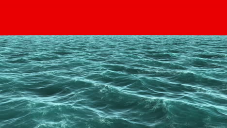 Choppy-blue-ocean-under-red-screen-sky-