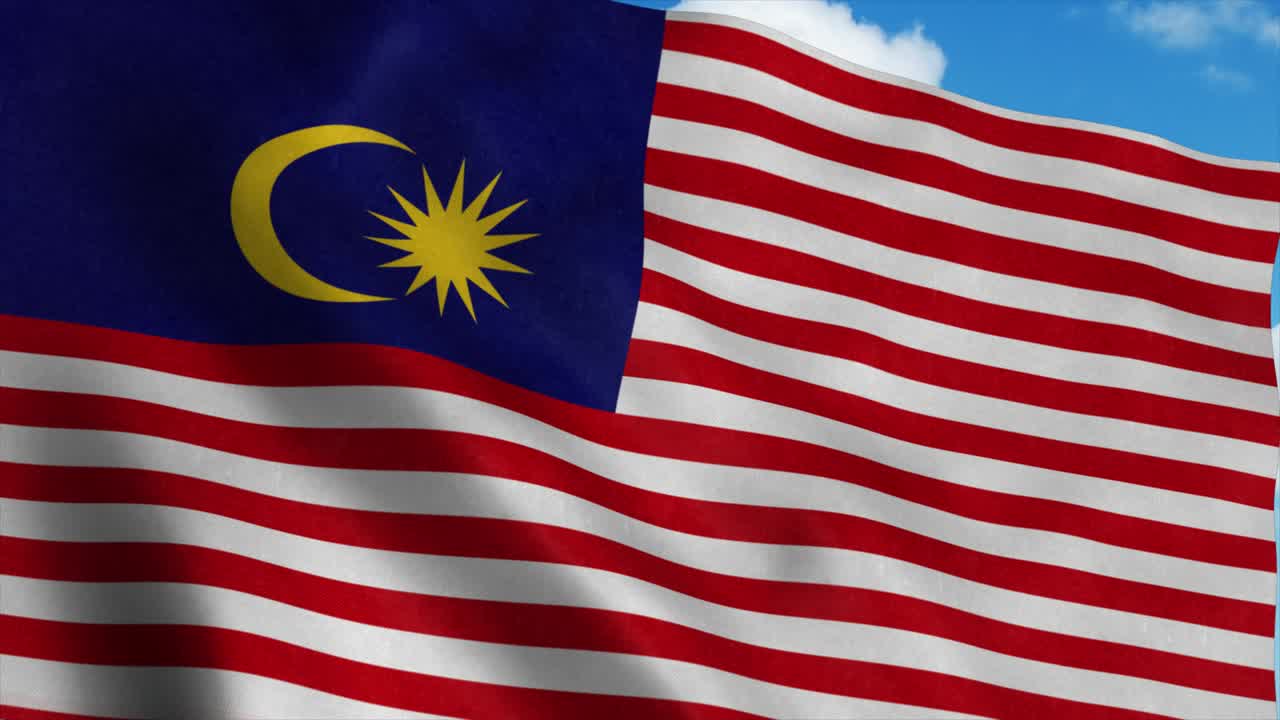 Bandiera della Malesia che sventola al vento, sfondo cielo blu. 4K