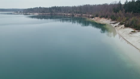 't nije hemelriek lake in the early morning with forest in gasselte, netherlands