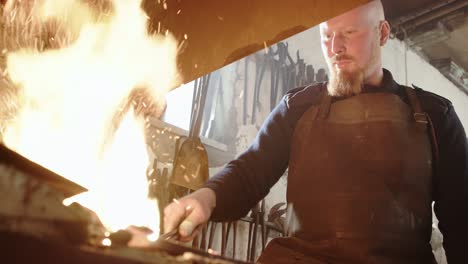 blacksmith working with forge