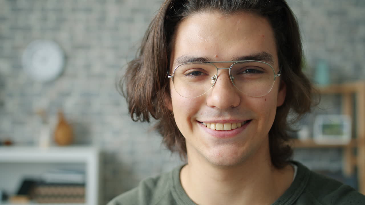 Smiling Young Man in Glasses