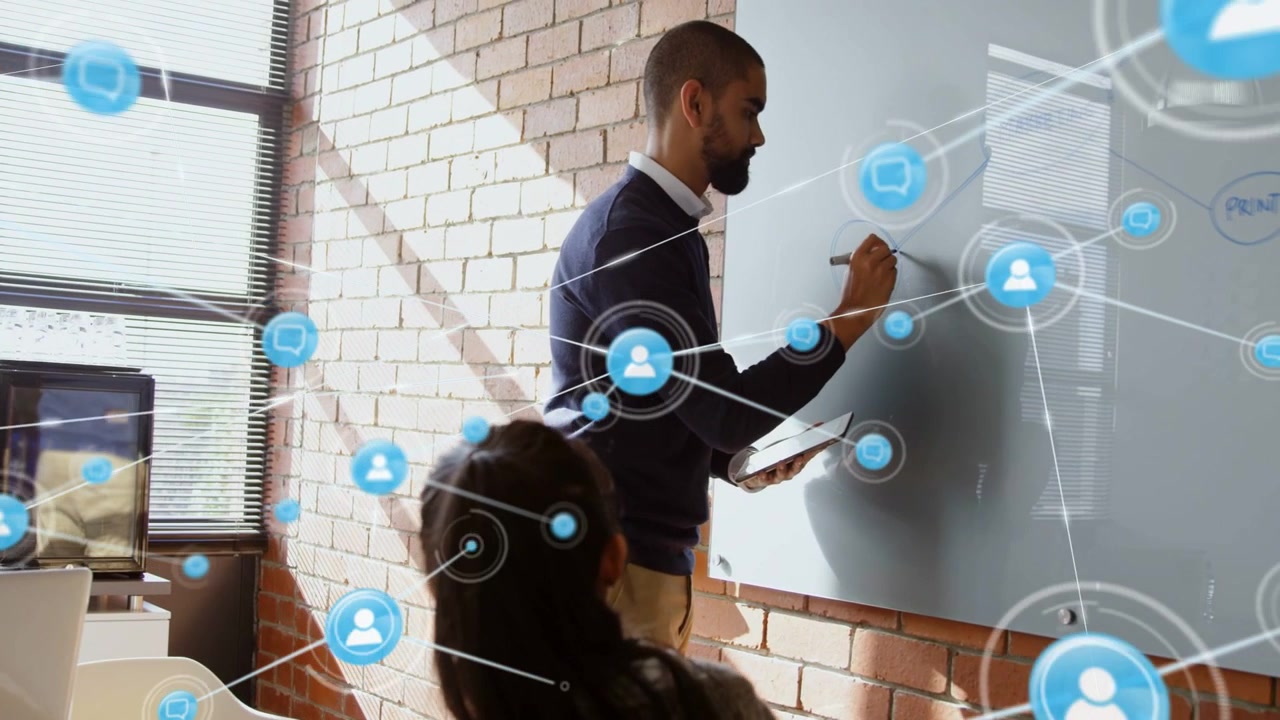 Starting man writing chart on office glass board for meeting with tablet overlay growing