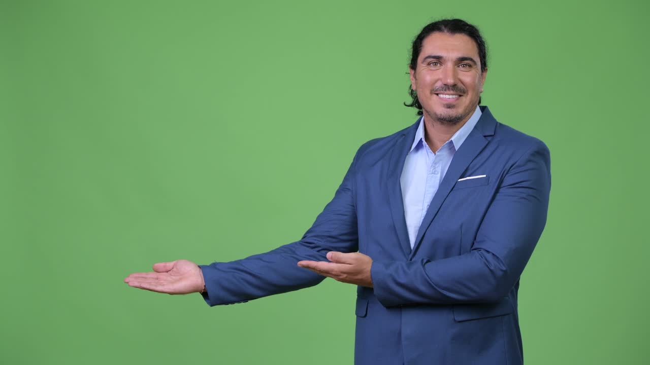 Handsome businessman showing something