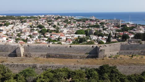 old medieval fortification walls around rhodes old town on a sunny summer day