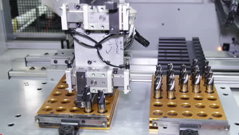 robotic arm putting tools in slots