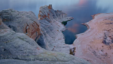 a breathtaking aerial perspective reveals the sculpted cliffs and shimmering lake nestled within glen canyon.