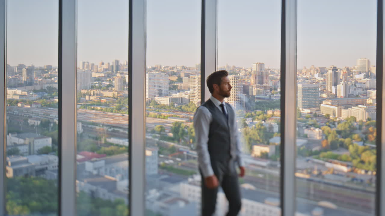 Boss looking evening city in contemporary office. Pensive professional resting
