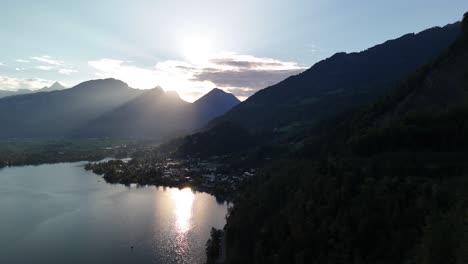 sunset over alpine lake and mountains