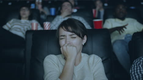 woman crying at movie theater