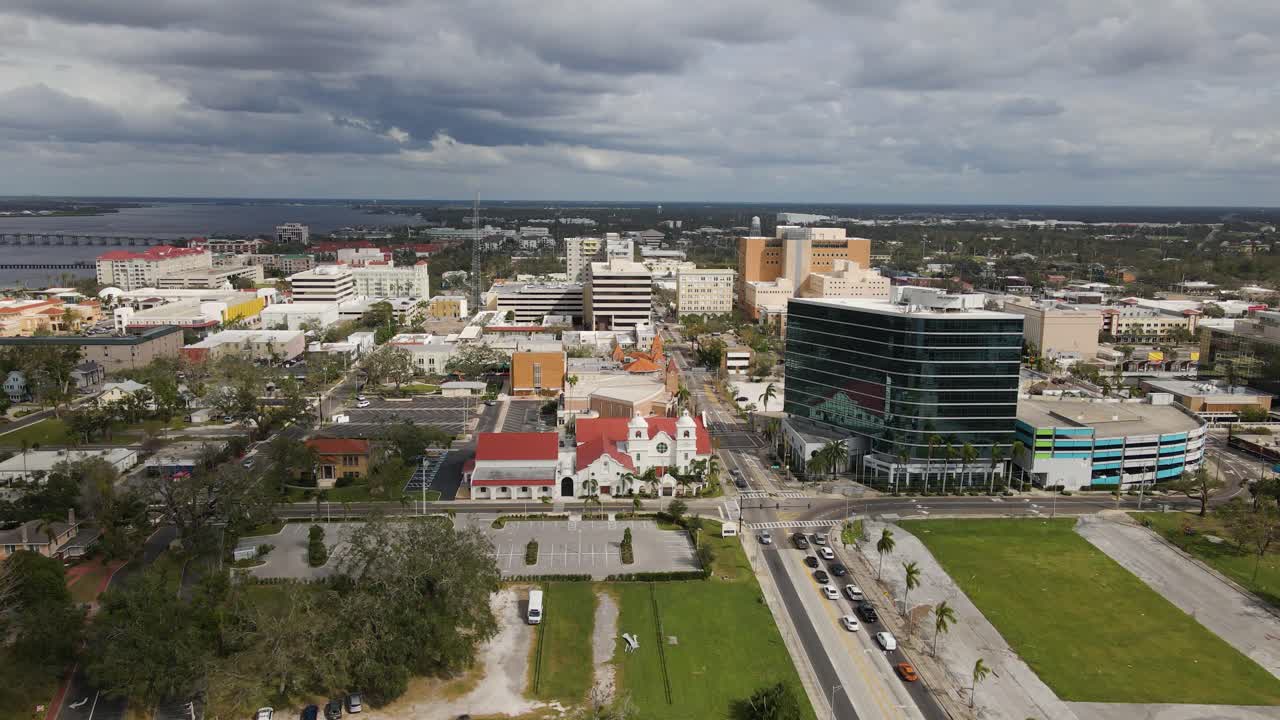 Aerial of Downtown Bradenton, Florida in Manatee County showcasing urban buildings and streets. Cloudy Day E