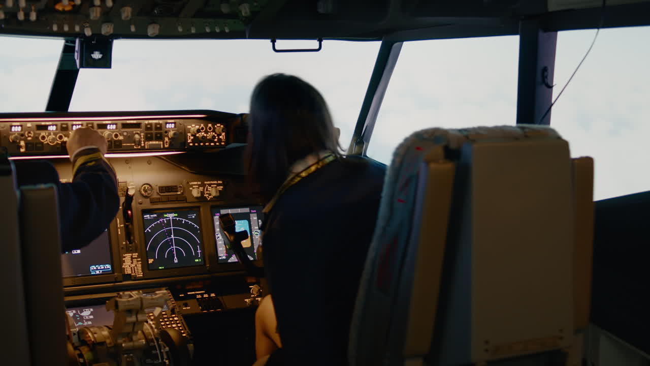 Team of captain and woman copilot fixing altitude and longitude