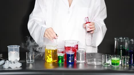 science experiment with colorful liquids and smoke