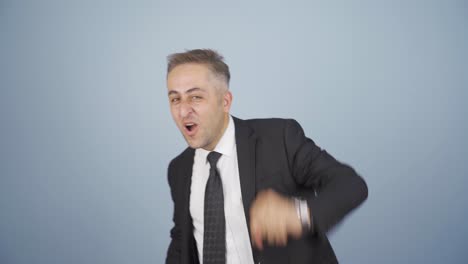 businessman dancing to the camera.