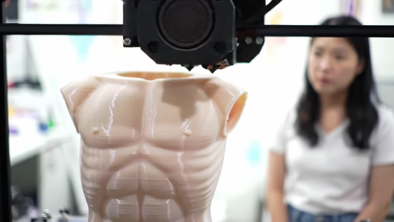 An In-Depth View of a 3D Printer Creating a Highly Detailed Human Torso Model with a Focus on Realism and Precision While Engaging Observers in the Background