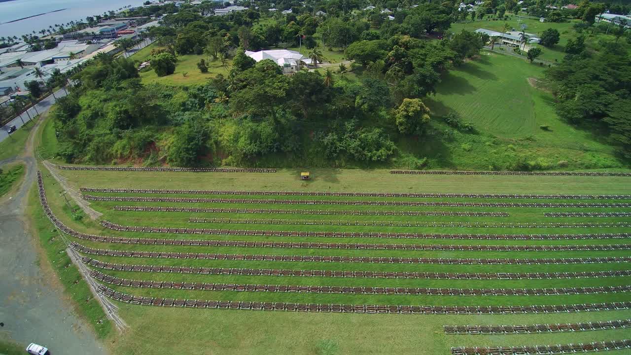 Fiji Travel - Sugar Cane Railcars - Aerial Drone Flight - Narrow guage railcars used to bring raw sugar cane to the refinery.