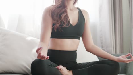 Young-Asian-women-lovey-with-yoga-exercise-and-stretching-in-the-living-room