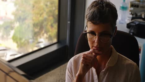 businesswoman working on computer at desk 4k