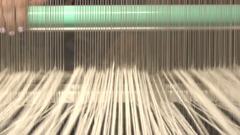 a loom with threads in action-9