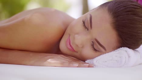 lovely young woman relaxing at a spa