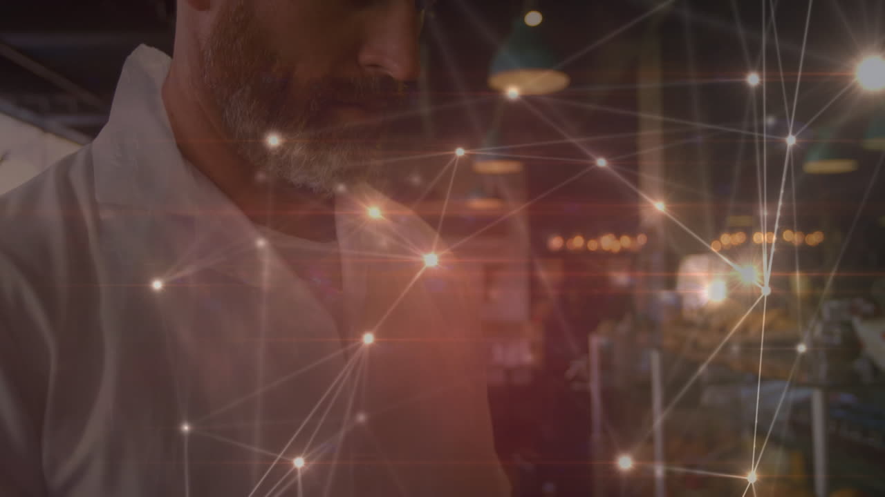 red brillante de conexiones contra el retrato de un anciano caucásico usando una tableta digital