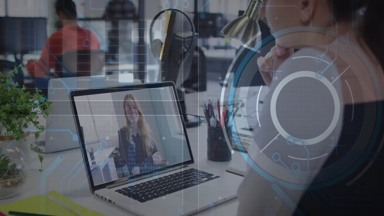 Video conferencing on laptop, person using animation overlay in office