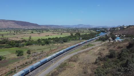 top view of train passing over konkan region mountains in pune maharashtra india.