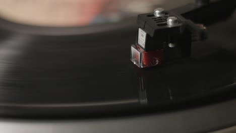 a closeup of a stylus on a vintage record player