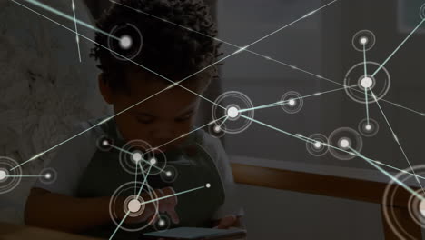 animation of networks of connections with icons over child using smartphone