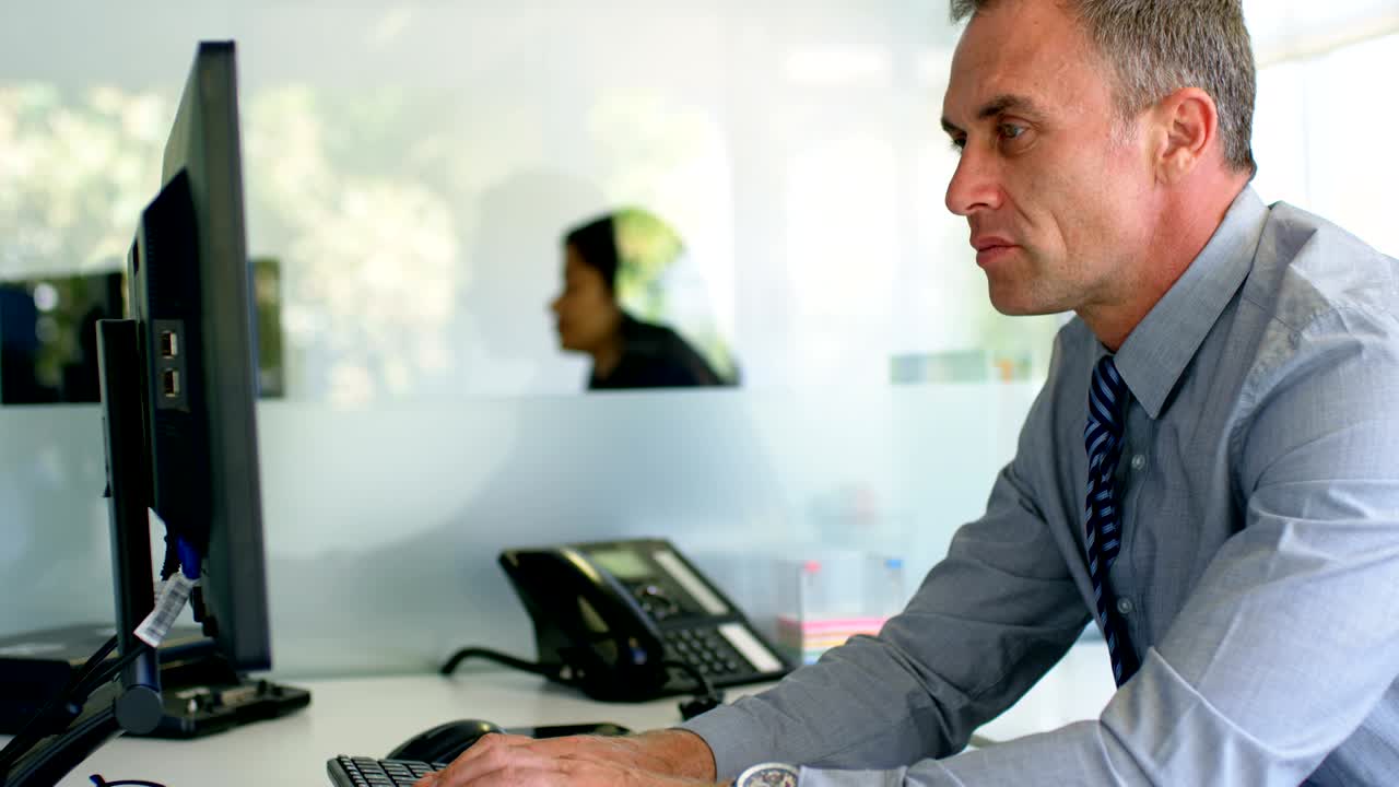 Businessman working on computer art desk 4k