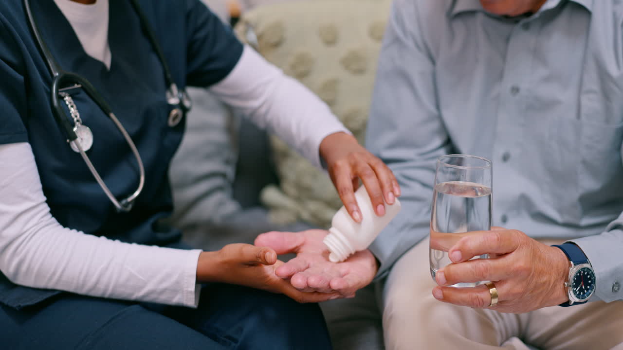 Nurse assisting senior patient with medication