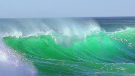 cinematic slow-motion stunning aqua blue huge wave surf swell wind froth hossegor seignosse biarittz basque country european holiday destination wsl ocean tide stunning summer day pan follow right