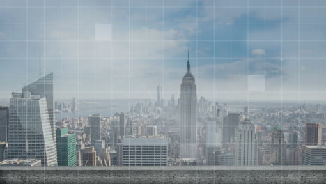 empire state building rising behind rooftop ledge, showing faint grid overlay across urban skyline