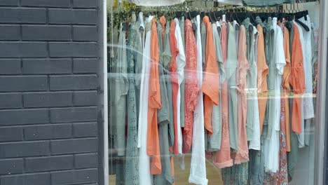 clothes hanging in store window