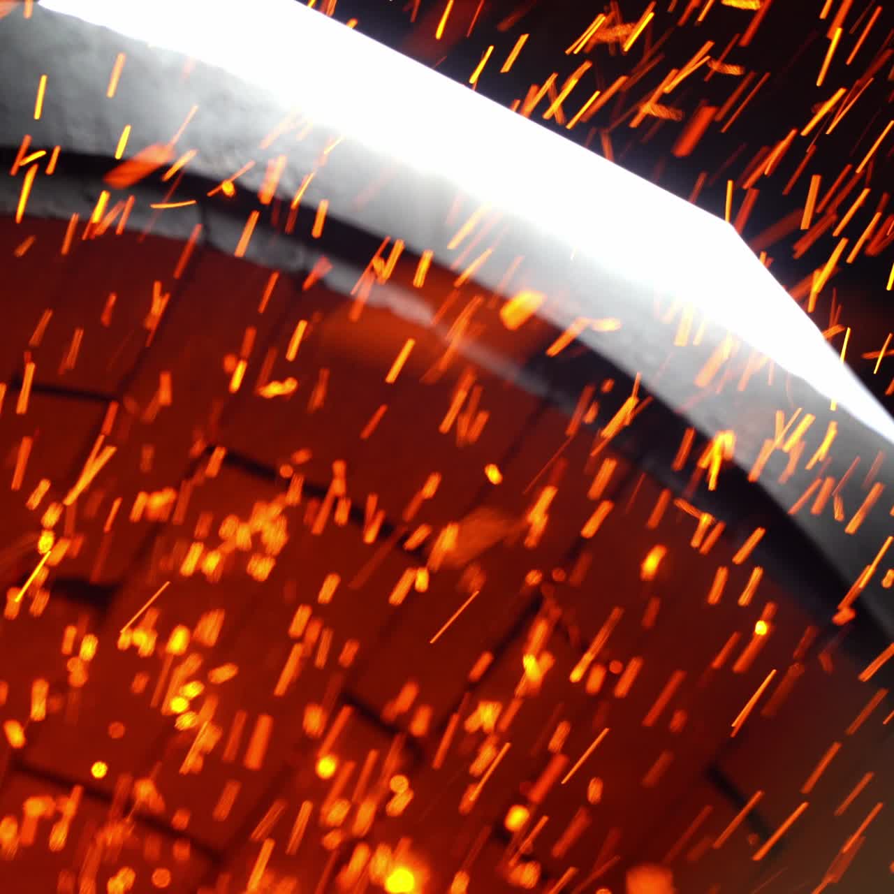 Numerous shining particles being emitted from a stove pipe. Orange and yellow sparks flying fast at black backdrop