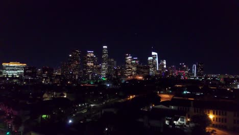 wide aerial shot of downtown los angeles skyline at night