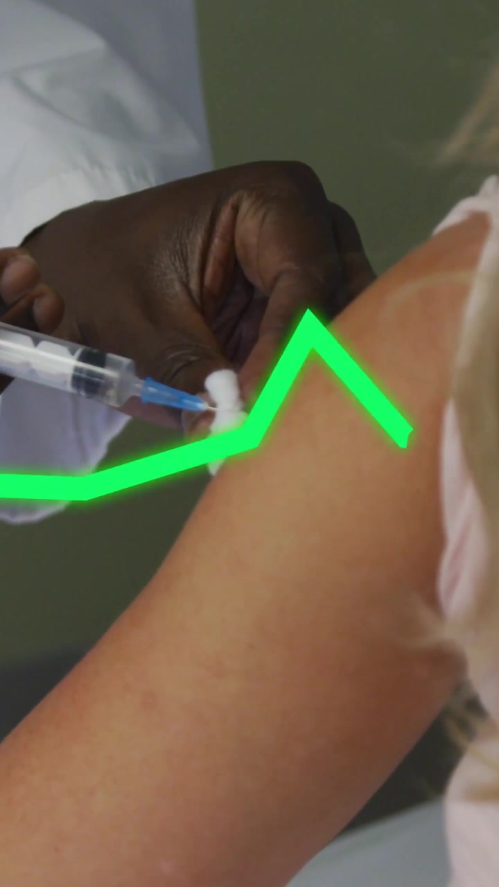 Vertical video: Nurse pressing cotton and injecting jab while green yellow lines animating over arm