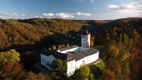 state chateau, hradec nad moravicí and white tower during autumn season in hradec nad moravicí, czechia