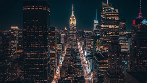 nighttime aerial view of new york city skyline with empire state building