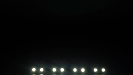 light from the spotlights through the smoke on stage during a performance or show