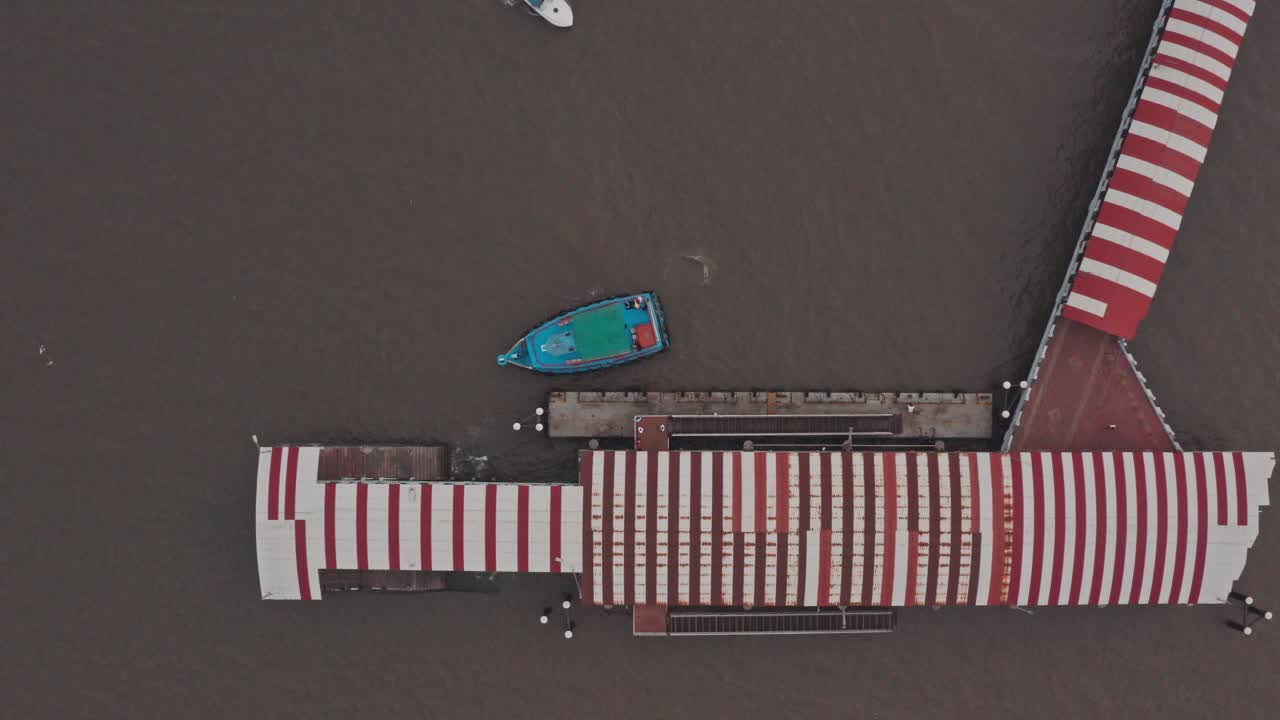 Top down drone shot of passenger and speed boat docking at mandwa jetty India