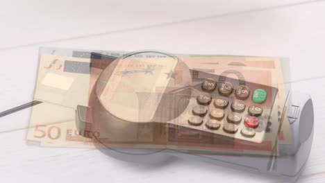 animation of euro banknotes falling over payment terminal