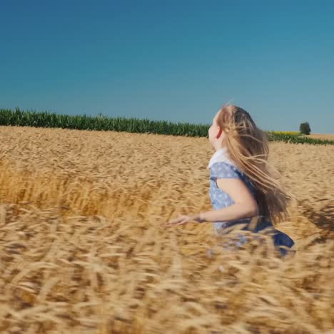 a child in a hat walks along the path in wheat 1