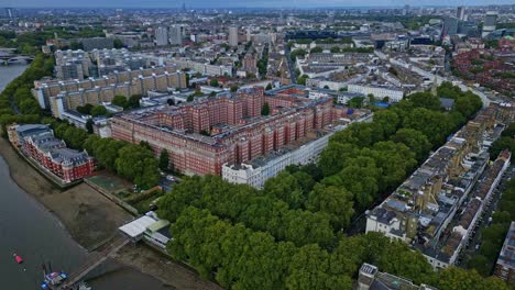 dolphin square near thames river in pimlico, westminster, london. aerial drone forward and cityscape