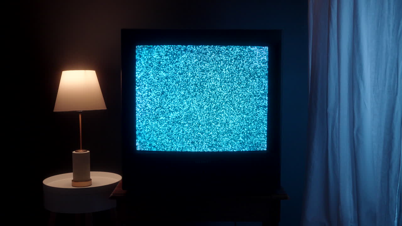 A static tv sits in a living room.